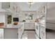 Efficient white kitchen with stainless steel appliances, bright lighting, and tile flooring at 3061 W 92Nd Ave # 8B, Westminster, CO 80031