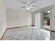 Inviting living room with tile floors, ceiling fan, and sliding door access to the backyard deck at 3061 W 92Nd Ave # 8B, Westminster, CO 80031