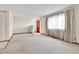 Bright living room featuring plush carpet, natural light, and a welcoming entrance at 3061 W 92Nd Ave # 8B, Westminster, CO 80031