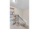 Staircase featuring a chairlift, carpeted steps, and white walls at 3061 W 92Nd Ave # 8B, Westminster, CO 80031