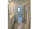 Bathroom featuring double vanity, tile flooring, and a glass-enclosed shower at 6731 Arbor E Blvd, Thornton, CO 80602