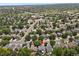 Aerial view shows the neighborhood's layout and proximity to local shopping and other amenities at 9665 Whitecliff Pl, Highlands Ranch, CO 80129