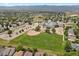 Extensive aerial showing proximity to open land, a baseball field, a school, and a well-maintained neighborhood at 9665 Whitecliff Pl, Highlands Ranch, CO 80129