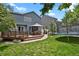 Backyard featuring a wood deck with gazebo, a lush lawn, and a trampoline at 9665 Whitecliff Pl, Highlands Ranch, CO 80129