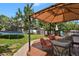 Beautiful backyard with trampoline, storage shed, seating area with gazebo and a lush lawn at 9665 Whitecliff Pl, Highlands Ranch, CO 80129