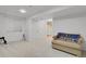 Finished basement with neutral carpet, double door closet, and convenient access to a bathroom at 9665 Whitecliff Pl, Highlands Ranch, CO 80129