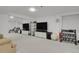 Finished basement featuring large mirrors, neutral carpet, and a home gym setup at 9665 Whitecliff Pl, Highlands Ranch, CO 80129