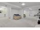 Finished basement boasts plush carpeting, mirrored wall, and convenient access to a full bathroom at 9665 Whitecliff Pl, Highlands Ranch, CO 80129
