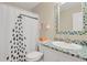 Bathroom featuring a custom designed tiled sink counter and a shower with a decorative shower curtain at 9665 Whitecliff Pl, Highlands Ranch, CO 80129
