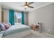 Bedroom featuring carpet, ceiling fan, turquoise curtains, and window with natural light at 9665 Whitecliff Pl, Highlands Ranch, CO 80129