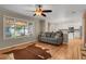 Open-concept living room featuring hardwood floors and access to the kitchen at 9665 Whitecliff Pl, Highlands Ranch, CO 80129