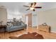 Living room leading to kitchen with hardwood floors and access to the backyard at 9665 Whitecliff Pl, Highlands Ranch, CO 80129