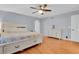 Spacious main bedroom with hardwood floors and ceiling fan at 9665 Whitecliff Pl, Highlands Ranch, CO 80129