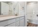 Clean bathroom with white cabinets and a shower/tub combo at 42734 Calusa Pines Rd, Elizabeth, CO 80107