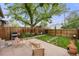 Landscaped backyard featuring a patio with seating, perfect for outdoor entertaining at 194 S Emerson St, Denver, CO 80209