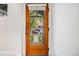 Elegant wooden front door with glass panels offering a glimpse of the charming neighborhood outside at 194 S Emerson St, Denver, CO 80209