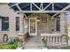 Inviting front porch featuring stone columns, decorative railing, and a bright, welcoming entrance at 194 S Emerson St, Denver, CO 80209