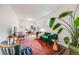 Spacious living area with vibrant rug, modern furniture, and a large houseplant, creating a stylish vibe at 194 S Emerson St, Denver, CO 80209