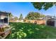 Large, fenced backyard with mature trees, play structure, storage shed and patio at 10640 Nw Routt Way, Westminster, CO 80021