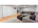 Inviting basement living area featuring hardwood floors, neutral walls, and recessed lights at 10640 Nw Routt Way, Westminster, CO 80021
