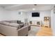 Basement living room featuring a comfortable seating area, TV, and hardwood floors at 10640 Nw Routt Way, Westminster, CO 80021