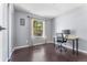 Bright home office with sleek dark wood floors, and a simple desk perfect for productivity at 10640 Nw Routt Way, Westminster, CO 80021