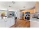 Open kitchen featuring stainless appliances, wood cabinets and a large island for dining and entertaining at 10640 Nw Routt Way, Westminster, CO 80021