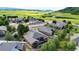 Picturesque aerial view of a quiet neighborhood, with well-manicured lawns, set against a backdrop of rolling hills at 20401 High Pines Dr, Monument, CO 80132
