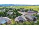 Expansive aerial view of a charming neighborhood with lush greenery and breathtaking mountain vistas at 20401 High Pines Dr, Monument, CO 80132
