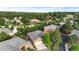 Aerial view of the homes nestled among the beautiful trees in the neighborhood with well maintained green spaces at 20401 High Pines Dr, Monument, CO 80132