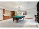 Finished basement featuring a pool table and custom bar at 20401 High Pines Dr, Monument, CO 80132