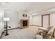 Spacious finished basement with a stone fireplace and neutral carpet at 20401 High Pines Dr, Monument, CO 80132