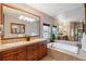 Elegant bathroom with double sinks, soaking tub, and stylish fixtures at 20401 High Pines Dr, Monument, CO 80132