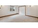 Bedroom with plush carpet, baseboard trim, and a large window at 20401 High Pines Dr, Monument, CO 80132