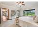 Comfortable bedroom with large windows offering scenic views of the outdoors at 20401 High Pines Dr, Monument, CO 80132