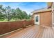 Relax on the private wooden deck, perfect for outdoor dining with views of the lush green landscape at 20401 High Pines Dr, Monument, CO 80132