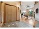 Open entryway with tile and wood flooring, leading to a naturally lit living space at 20401 High Pines Dr, Monument, CO 80132