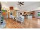 Open floorplan with hardwood floors, stone fireplace, and easy access to the kitchen and entrance at 20401 High Pines Dr, Monument, CO 80132