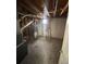 Unfinished basement showing exposed pipes, concrete floors, and water heater at 10866 Pearl St, Northglenn, CO 80233