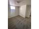 Finished basement area featuring carpet and a neutral color scheme with access to doors and egress windows at 10866 Pearl St, Northglenn, CO 80233