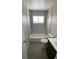 Bright bathroom featuring subway tile, white fixtures, vanity, and modern lighting at 10866 Pearl St, Northglenn, CO 80233