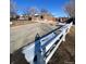 Charming brick home featuring a well-maintained exterior and a large, paved driveway at 10866 Pearl St, Northglenn, CO 80233