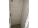 Tiled walk-in shower with modern fixtures, offering a clean and sleek design at 10866 Pearl St, Northglenn, CO 80233