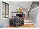 Home office with a large desk space and a view looking into the entryway at 4905 Hale Pkwy, Denver, CO 80220