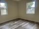 Well-lit bedroom with neutral decor and large windows at 1521 Yosemite St, Denver, CO 80220