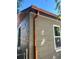 Close-up view of the home's exterior showing copper gutters and new paint at 1521 Yosemite St, Denver, CO 80220