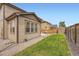 Lush backyard with green grass, an attached sunroom, and ample space for outdoor activities at 25128 E Maple Ave, Aurora, CO 80018