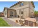 Cozy backyard patio with hot tub, string lights, a grill, and well-maintained landscaping at 25128 E Maple Ave, Aurora, CO 80018