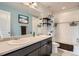 The bathroom has double sinks and a tub with shower at 25128 E Maple Ave, Aurora, CO 80018