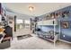 A playful bedroom with comic art and a bunk bed at 25128 E Maple Ave, Aurora, CO 80018